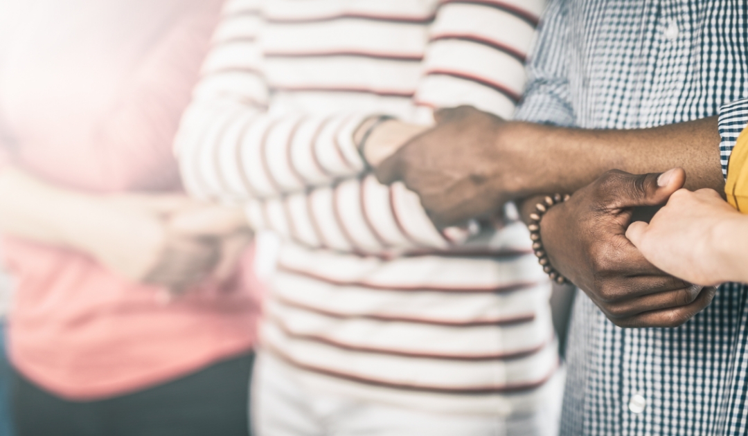 Many hands holding each other